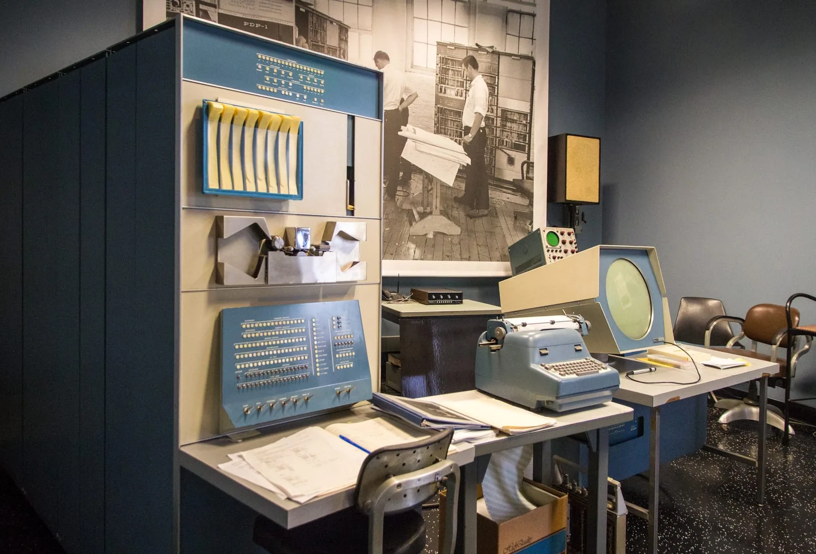 PDP-1 computer at the Computer History Museum. The large cabinet houses the processor, with the paper tape reader and punch visible above the desk.